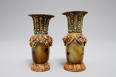 A pair of Tibetan agate flasks with turquoise- and coral-inlaid gilt silver mounts, 19th C.