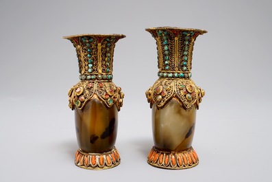 A pair of Tibetan agate flasks with turquoise- and coral-inlaid gilt silver mounts, 19th C.