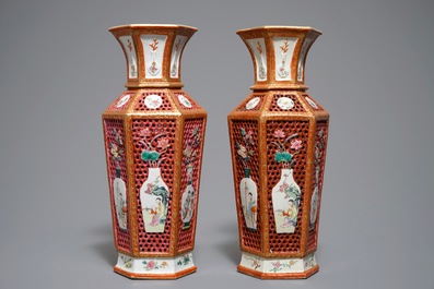 A pair of reticulated double-walled hexagonal Chinese famille rose vases, Yongzheng