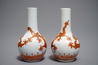 A pair of Chinese iron red and gilt bottle vases with dragons, Wanli mark, 19th C.