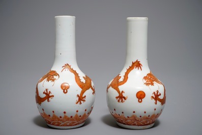 A pair of Chinese iron red and gilt bottle vases with dragons, Wanli mark, 19th C.