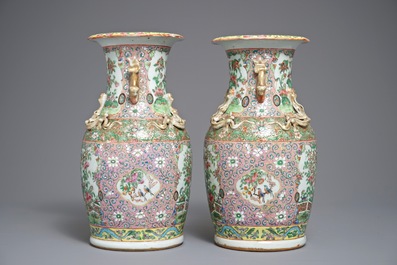 A pair of Chinese pink ground Canton vases, 19th C.