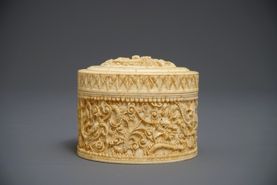 A round Chinese carved ivory dragon box and cover, 2nd half 19th C.