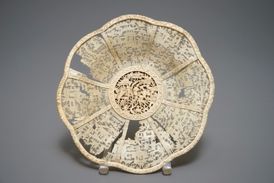 A Chinese pierced ivory basket and a small group of a lady with child, 19th C.