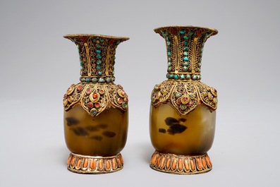 A pair of Tibetan agate flasks with turquoise- and coral-inlaid gilt silver mounts, 19th C.