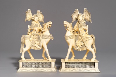 A pair of Chinese carved ivory horseriders, 19th C.