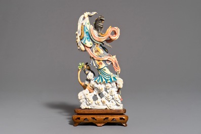 A Chinese polychrome carved ivory figure of Magu on wooden base, 1st half 20th C.