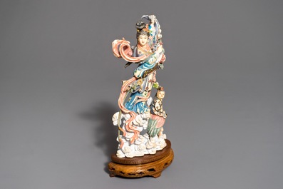A Chinese polychrome carved ivory figure of Magu on wooden base, 1st half 20th C.