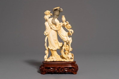 A Chinese carved ivory figure of Chang'e on wooden base, 1st half 20th C.