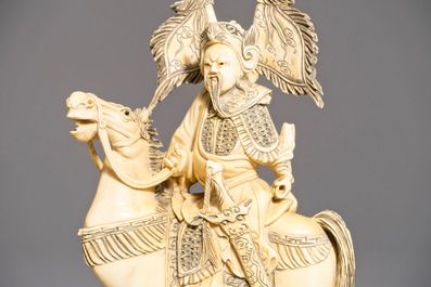 A pair of Chinese carved ivory horseriders, 19th C.