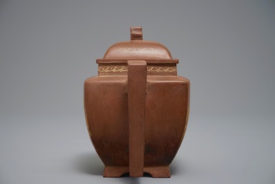 A Chinese Yixing teapot and cover with applied design, 20th C.