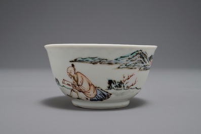 A Chinese cup and saucer with two figures in a landscape, Yongzheng