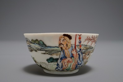 A Chinese famille rose cup and saucer depicting Lie Ti Guai with three goats, Yongzheng