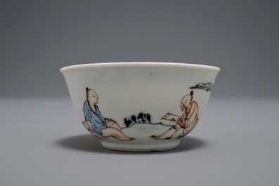 A Chinese cup and saucer with two figures in a landscape, Yongzheng