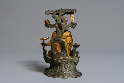 A Chinese gilt-lacquered bronze group of Guanyin with a child, 18th C.