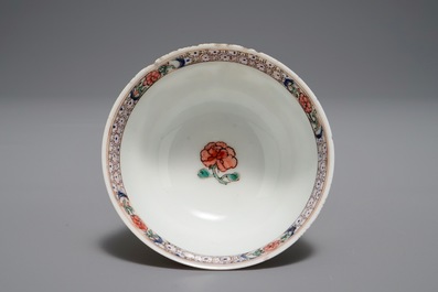 A Chinese famille rose cup and saucer depicting Lie Ti Guai with three goats, Yongzheng