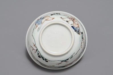 A Chinese cup and saucer with two figures in a landscape, Yongzheng