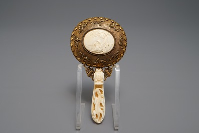 A Chinese gilt brass and ivory mirror, 19th C.
