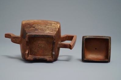 A Chinese Yixing teapot and cover with applied design, 20th C.