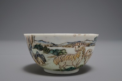 A Chinese famille rose cup and saucer depicting Lie Ti Guai with three goats, Yongzheng