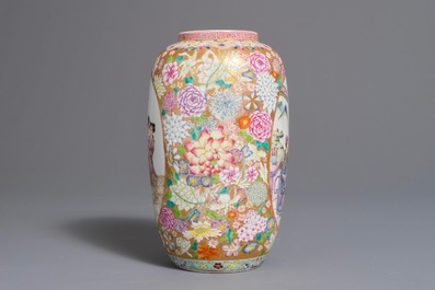 A Chinese famille rose millefleurs vase with figurative medallions, 20th C.