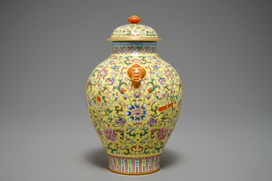 A Chinese famille rose yellow-ground vase and cover, Qianlong mark, 20th C.