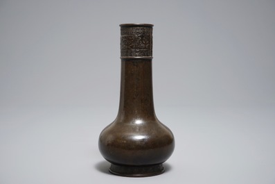 A Chinese bottle-shaped bronze vase with applied design, Yuan