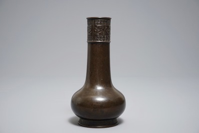 A Chinese bottle-shaped bronze vase with applied design, Yuan