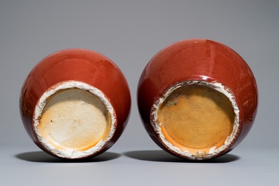 A pair of Chinese monochrome oxblood-glazed ginger jars and covers, 19th C.