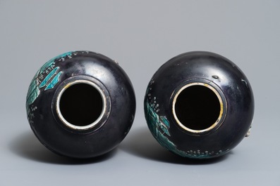 A pair of Chinese aubergine-ground Fahua jars with applied design, Kangxi