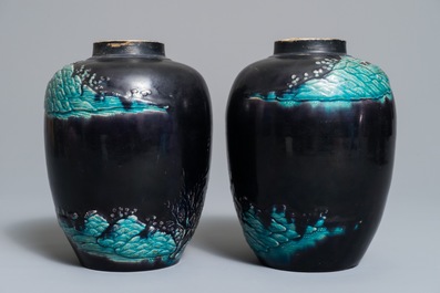 A pair of Chinese aubergine-ground Fahua jars with applied design, Kangxi