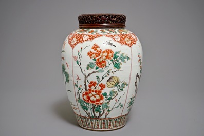 A Chinese famille verte vase with a carved wooden cover, Kangxi