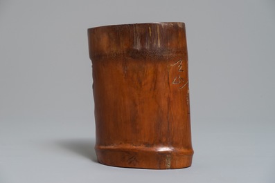 A Chinese carved and inscribed bamboo brushpot, 19th C.