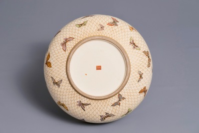 A Japanese Satsuma bowl with netted butterflies, Meiji, 19th C.