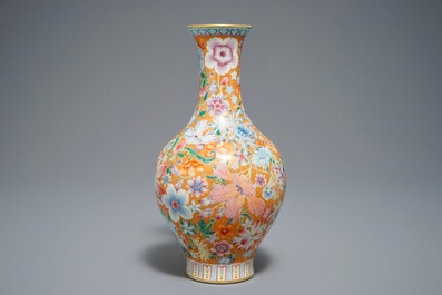 A Chinese famille rose millefleurs vase, Qianlong mark, 20th C.