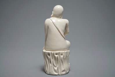 A Chinese Dehua blanc de Chine figure of a Luohan, 19th C.