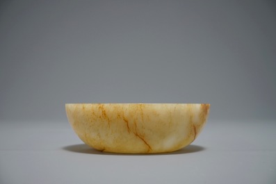 A Chinese russet jade bowl with triangular handle, 19/20th C.