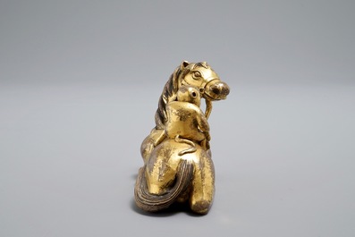 An inscribed Chinese gilt bronze model of a monkey on a horse, 19/20th C.