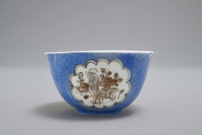 A Chinese cup and saucer with roosters in grisaille on a blue ground, Yongzheng