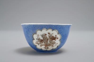 A Chinese cup and saucer with roosters in grisaille on a blue ground, Yongzheng