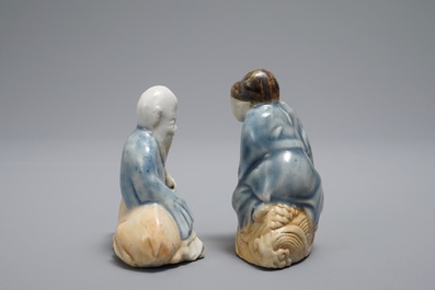 Two Chinese figurative blue and white on biscuit water droppers, Qianlong