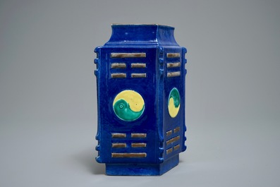 A Chinese blue-ground lozenge-shaped cong vase with taoist symbols, 19th C.