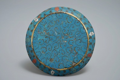 A Chinese cloisonn&eacute; saucer with floral design, Ming, and a round box and cover, 19th C.