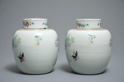 A pair of Chinese famille rose jars and covers with insects and flowers, Qianlong mark, 19/20th C.