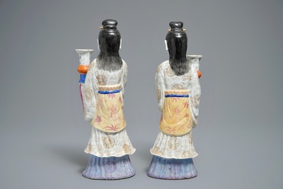 A pair of Chinese famille rose candle holders shaped as court ladies, 19/20th C.