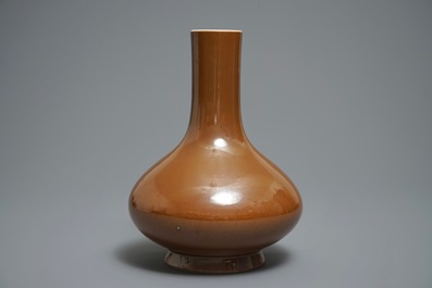 A Chinese cafe-au-lait glazed bottle vase, Qianlong mark, 19th C.