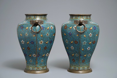 A pair of Chinese cloisonn&eacute; vases with floral design and ring handles, 19th C.