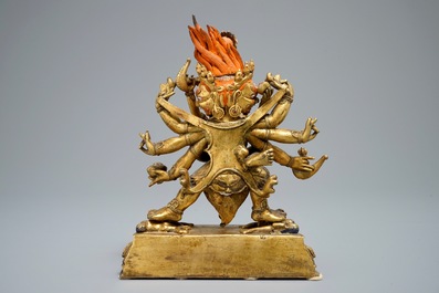 A Sino-Tibetan gilt bronze figure of Mahakala and his consort Yab-Yum, 19/20th C.