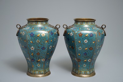 A pair of Chinese cloisonn&eacute; vases with floral design and ring handles, 19th C.