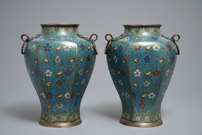 A pair of Chinese cloisonn&eacute; vases with floral design and ring handles, 19th C.